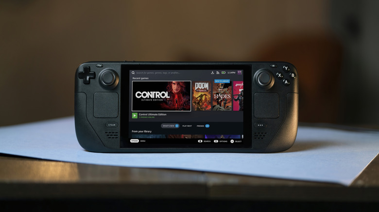 Steam Deck on table displaying the consoles menu