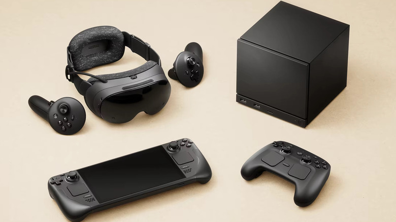 Valve's new chain of Steam Hardware products: the Steam Frame, the Steam Machine, and the Steam controller, lying beside the Steam Deck