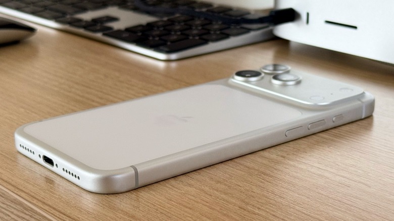 iPhone 17 Pro Max on a table with the Mac Studio just behind it