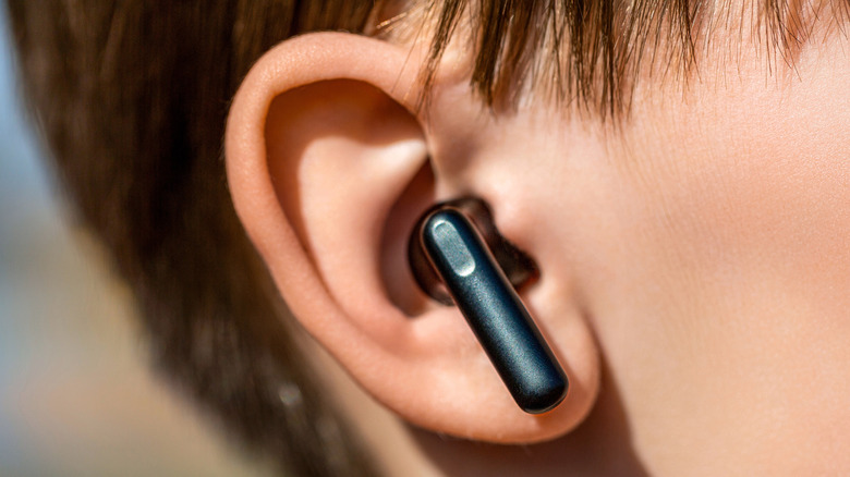 An close-up shot of an earbud in someone's ear.
