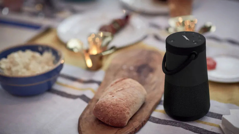 The Bose SoundLink Revolve+ II placed on a dinner table.