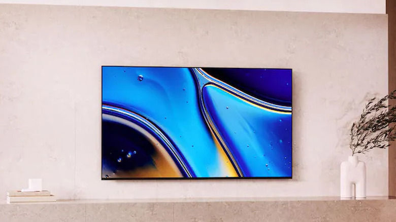 The Sony Bravia XR8B wall-mounted in a modern living room.