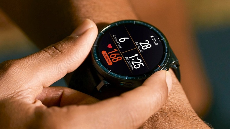 A person pushing a button on the Amazfit Active Max