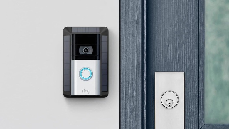A Ring video doorbell mounted inside the Ring Solar Charger.
