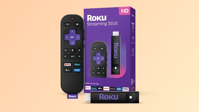 Roku Streaming Stick next to its packaging and remote