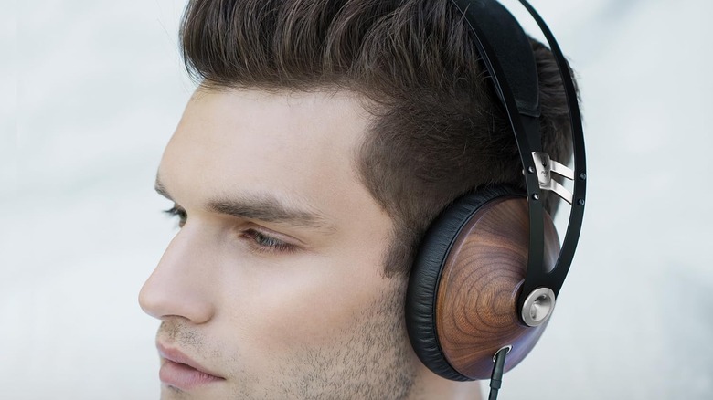 Close-up of young man wearing a pair of Meze Audio 99 Classics