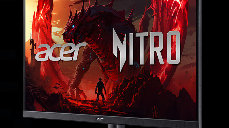 Close-up of Acer Nitro 27-inch gaming monitor with massive dragon-like monster showing on display
