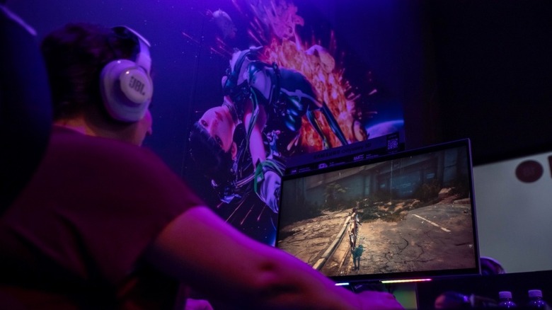Person playing video games on a Samsung Odyssey branded monitor