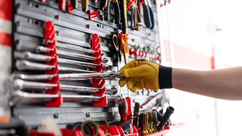 A range of tools hanging on the wall