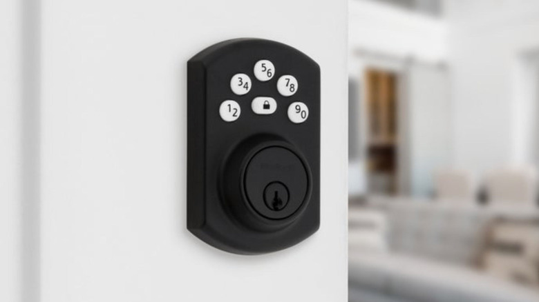 The Kwikset Powerbolt 240 smart lock mounted to a door
