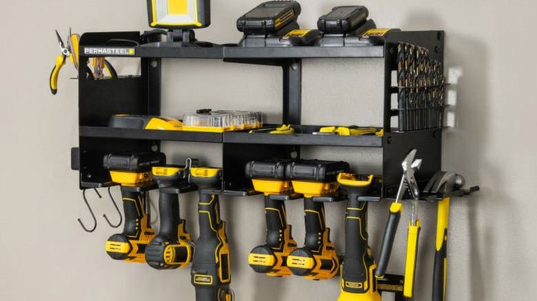 The Permasteel power tool organizer is mounted to a wall and loaded with tools.