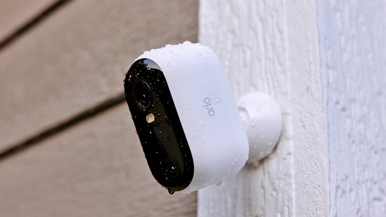 An Arlo Essential Security Camera 2K (3rd Gen) mounted on the exterior of a house