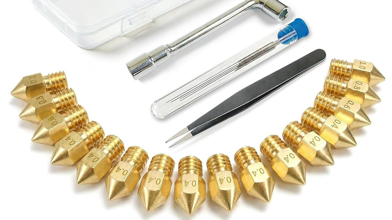 Set of brass 3D printer nozzles with cleaning tools and tweezers