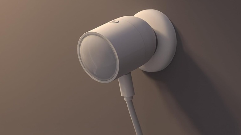A Sonoff Zigbee human presence sensor on a wall.