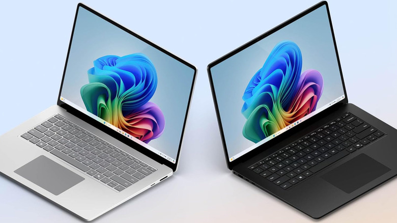 Silver and black Microsoft Surface Laptop models against a gradient background