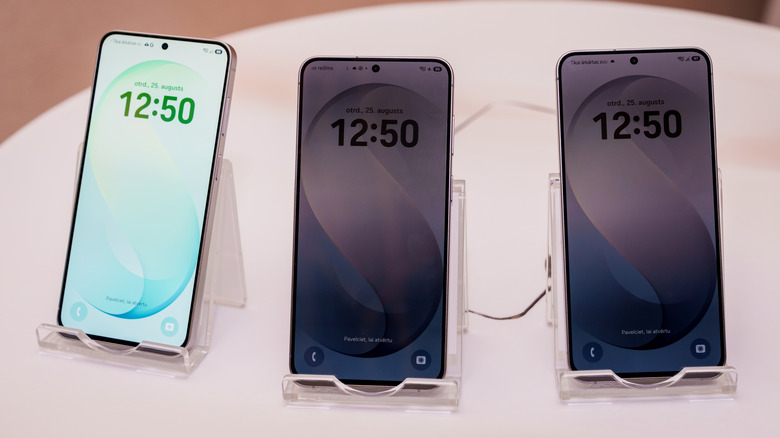 Trio of Samsung Galaxy S26 FE smartphones positioned on stands