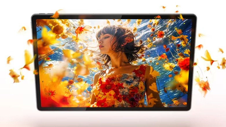 Lenovo Tab Idea Plus with a woman on screen surrounded by yellow flower petals.