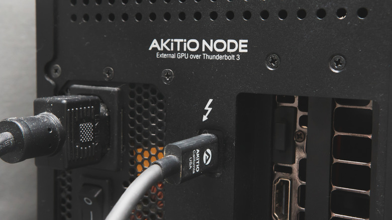 The back input/output section of an eGPU with a Thunderbolt cable plugged in