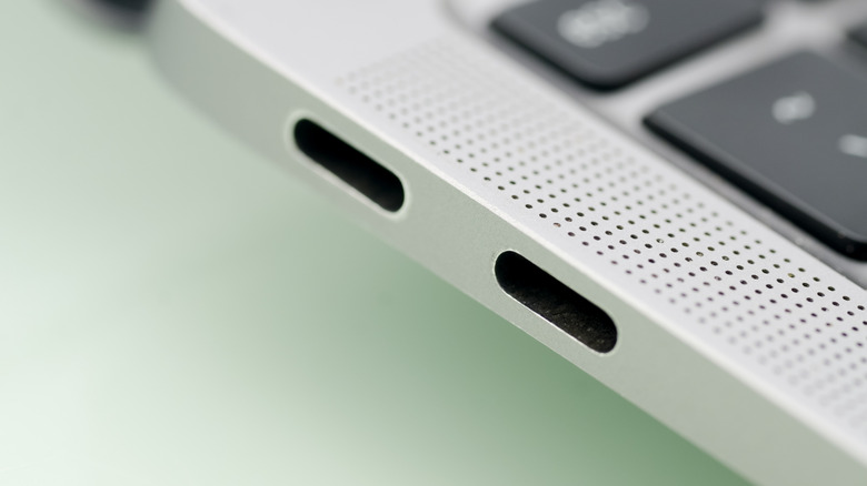 Two thunderbolt ports on the side of a MacBook