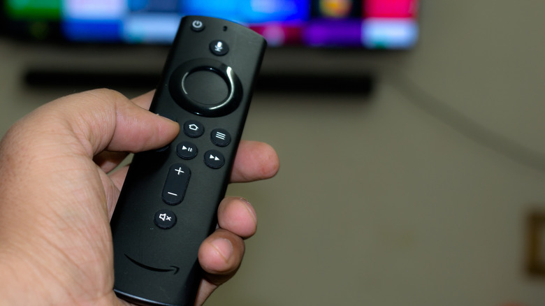 Amazon fire stick TV remote in hand