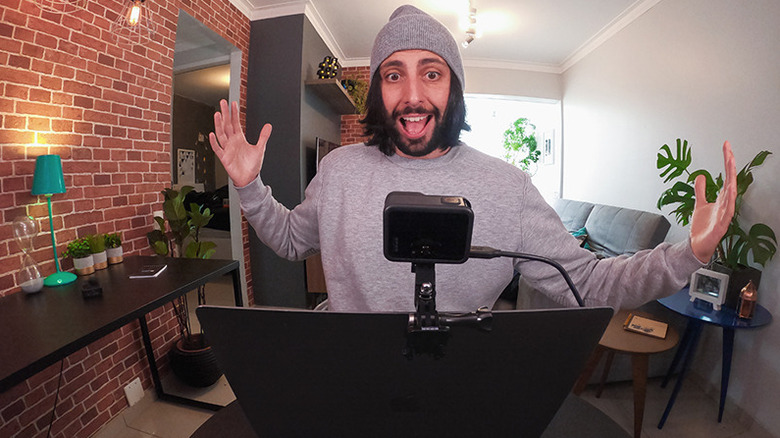 Man using GoPro as webcam mounted to laptop