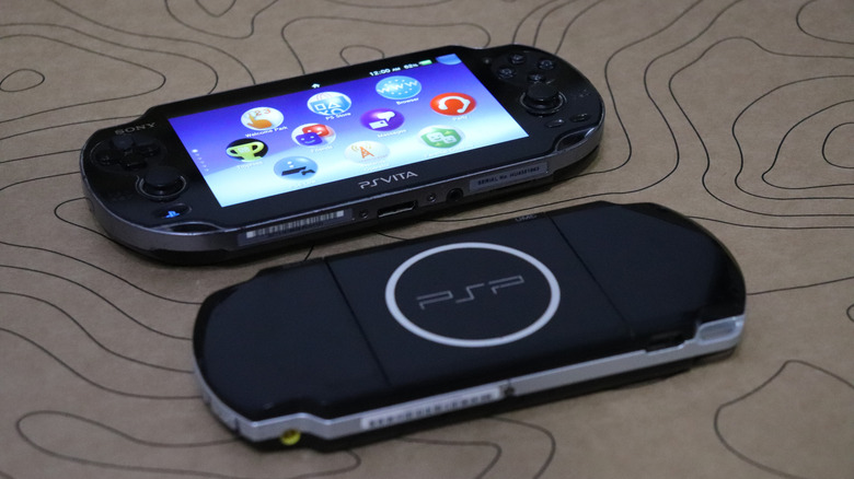 PlayStation Vita faced up above a PlayStation Portable