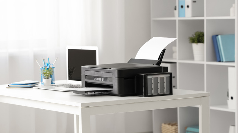 Home printer on home office desk