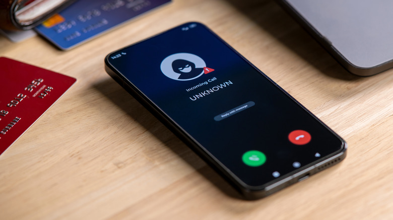 phone placed on a table receiving a call from an unknown number