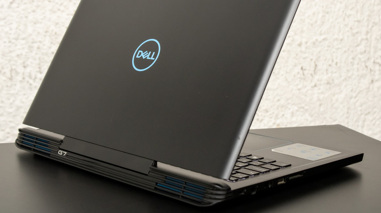 A Dell G7 laptop open on a table