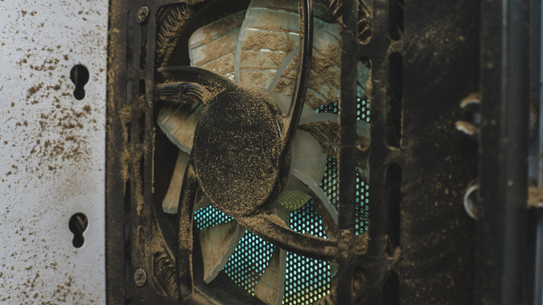 A desktop PC fan covered in dust