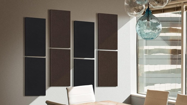 The Umiacoustics acoustic panels are mounted to a flat wall in a conference room.