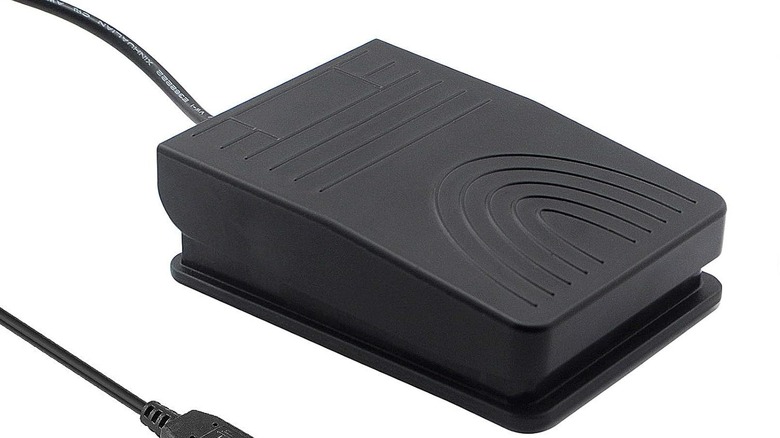 Close-up of iKKEGOL foot pedal switch on a white background