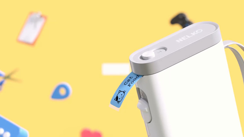 Close-up of Neko bluetooth connected label maker with blue "cat food" label sticking out of it