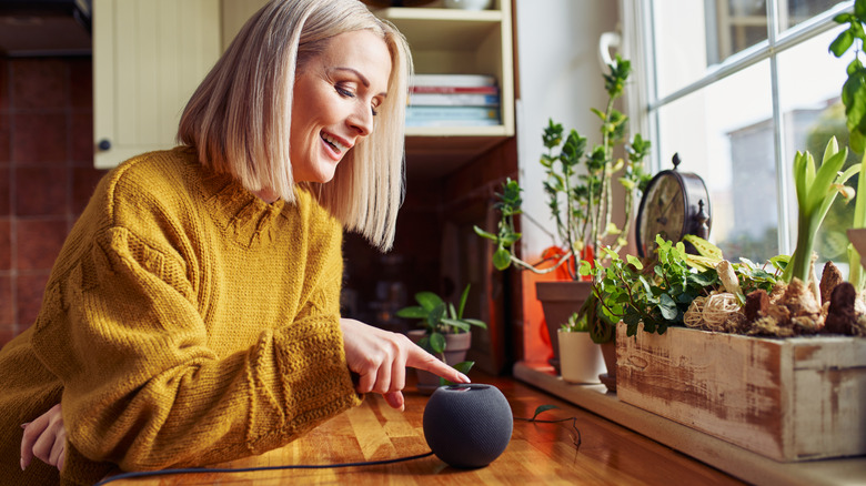 person talking to Amazon smart speaker