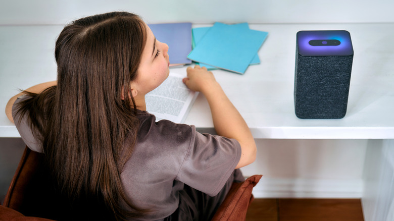 child asking smart speaker for homework help