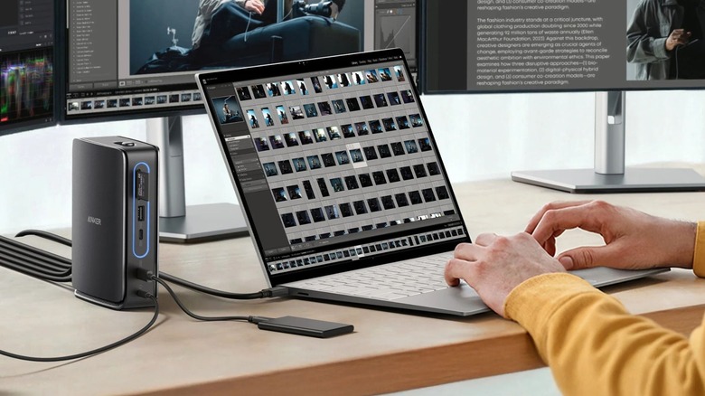 A laptop and and SSD plugged into an Anker 13-in-1 Docking Station