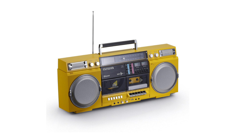 A modern portable audio player in yellow in the style of a vintage boombox