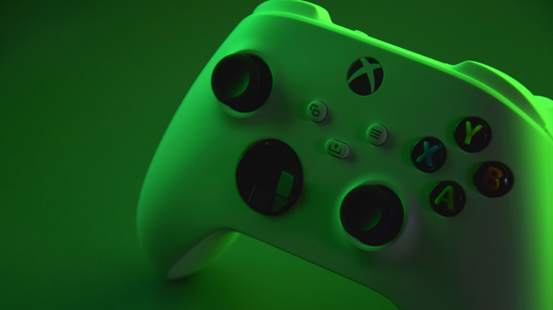 A green Xbox controller on a green background.