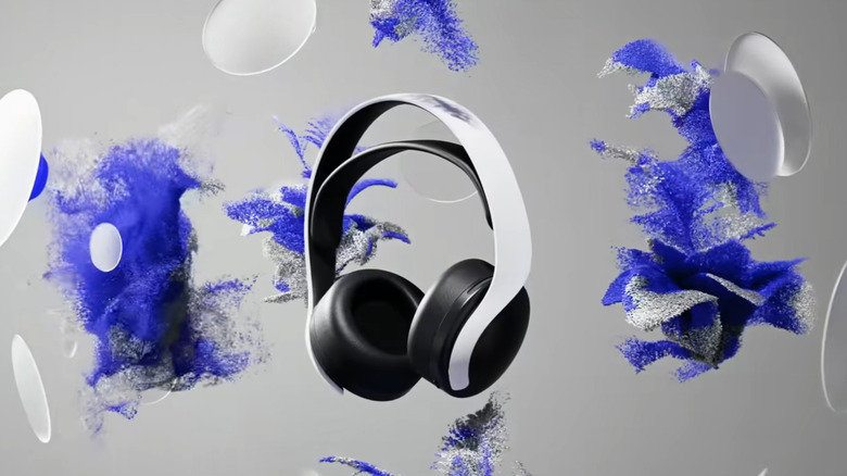 White headphones surrounded by white circles and blue and white effects meant to represent the PlayStation 5's 3D Audio