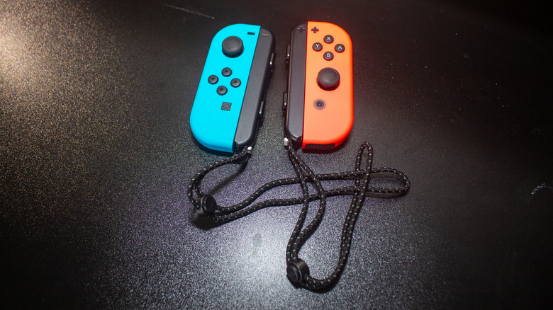 A pair of Nintendo Switch Joy-Cons with wrist straps.