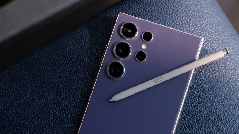 Galaxy S24 Ultra with S Pen resting on the back up close.