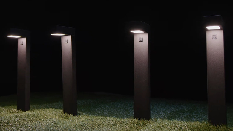 Four Atomi smart pathway lights turned on