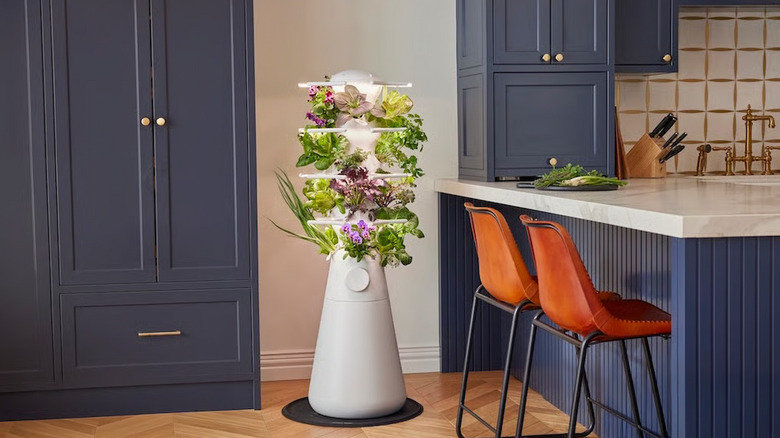 The Lettuce Grow Farmstand Nook (a white tower) in the corner of a kitchen