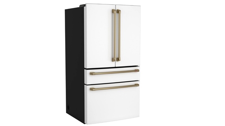 A white Café CGE29DP4TW2 4-door refrigerator with gold handles on a white background