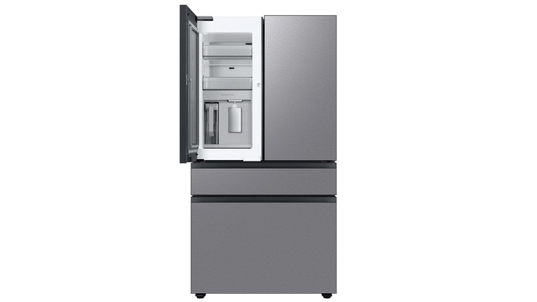 A dark gray Samsung RF29BB8600QL 4-door refrigerator with one french door open, set against a white background