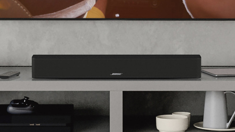 The Bose Solo Soundbar 2 set up beneath a TV on a TV stand.