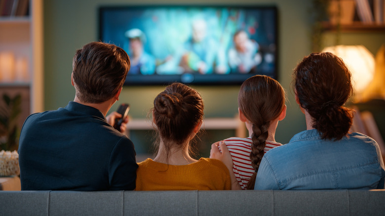 A family watching TV together