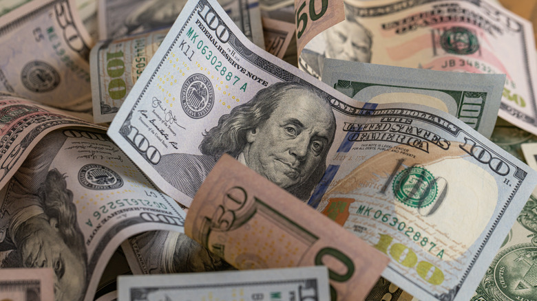 A collection of $50 and $100 U.S. notes.