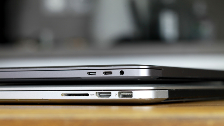 Two MacBooks showing ports