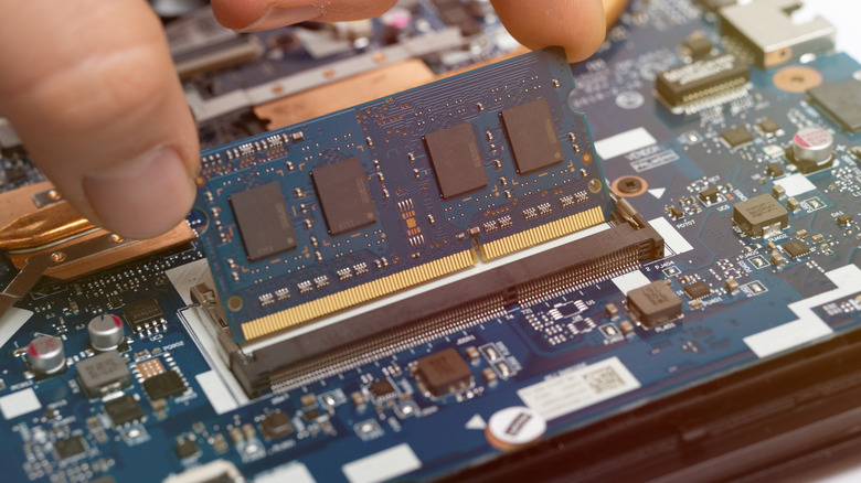 RAM module being installed on laptop